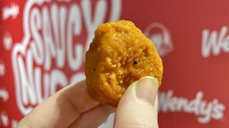 hand holding Wendy's Saucy Nugget 