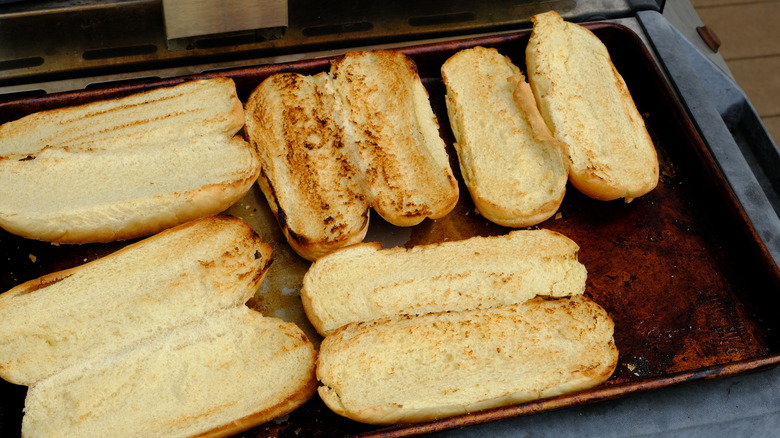 Hot dog buns on grill