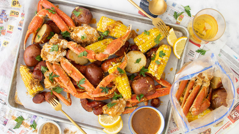 crab legs, potatoes, sausage, corn