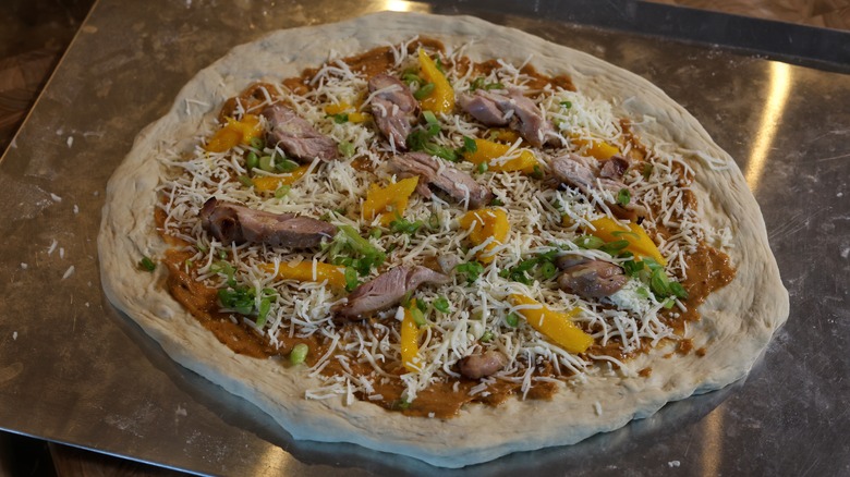 uncooked thai chicken pizza
