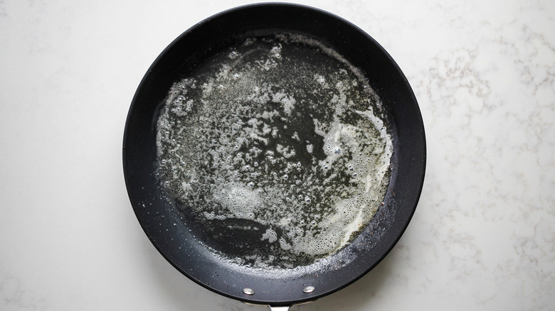 melted butter in frying pan
